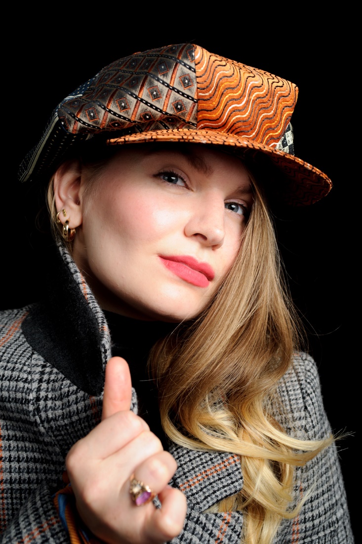 Mari Michelson with her OHOV cap made of silk collected from second hand men's ties. Photo courtesy: Mari Michelson. 