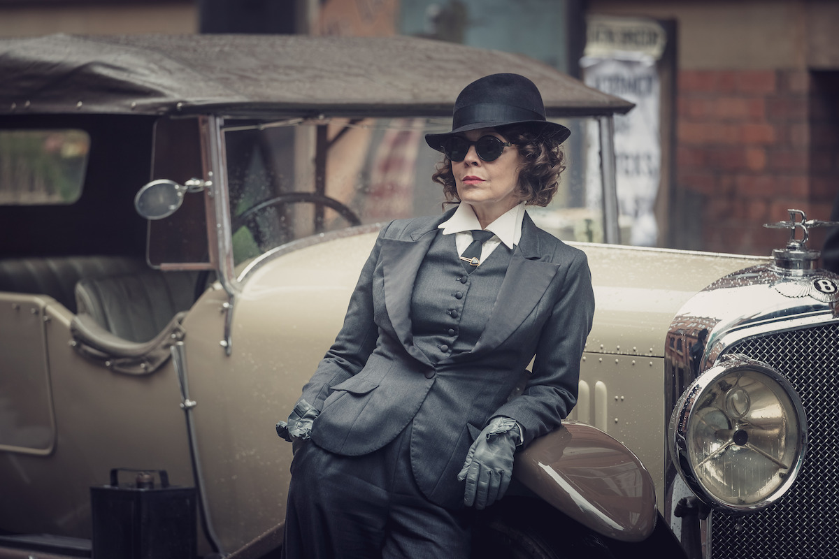 Aunt Polly in one of her tailored suits, exuding power and confidence.