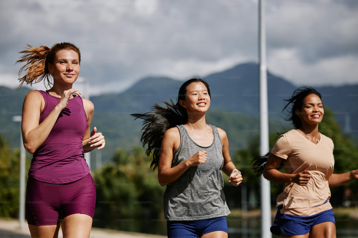 a group of three women running down a street. They do not face any problem as they are using good cloth pads.