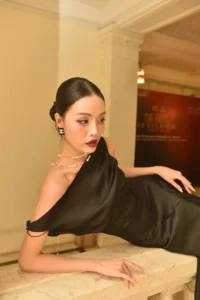 Classic black dress with pearls and elegant updo hairstyle 1960s inspired