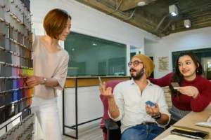 Fashion buying and merchandising team meeting to review seasonal product range